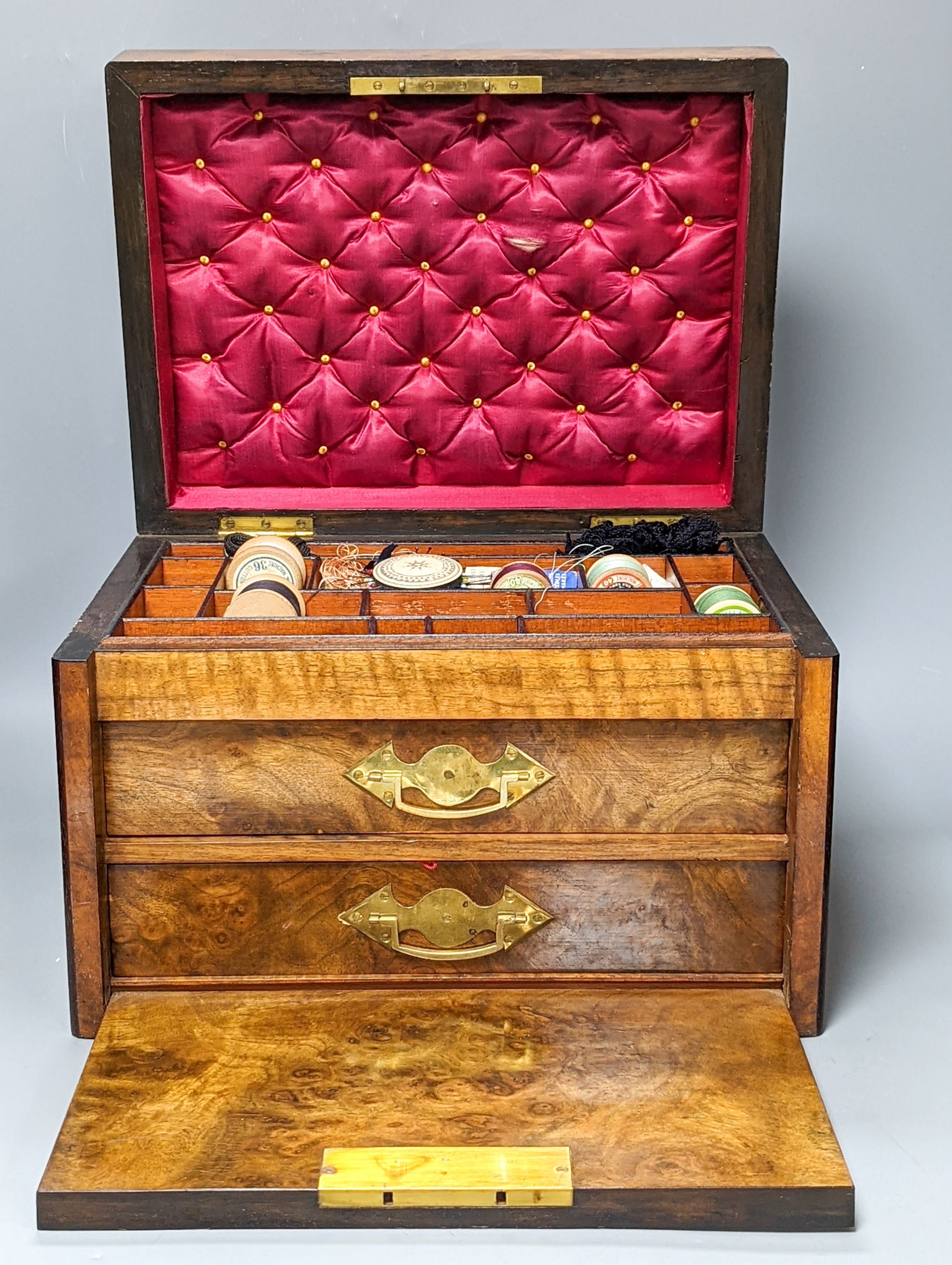 A Victorian walnut sewing casket, 34cm, containing sewing related accessories